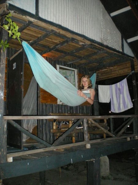 Sel chilling in the hammock at our beach hut!