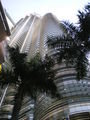 at the foot of one of the petronas towers looking up