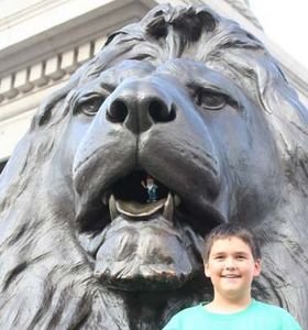Zach and Heathcliffe (in the lion's mouth) at Nelson's column