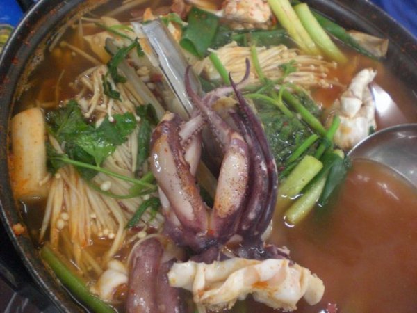 Seafood soup, with a whole Octopus