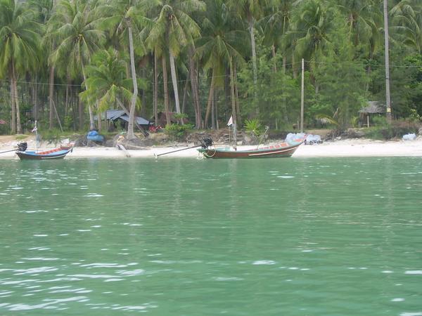 The waters of Koh Pha Ngan and an example of the boat taxi we took to "bottle beach"