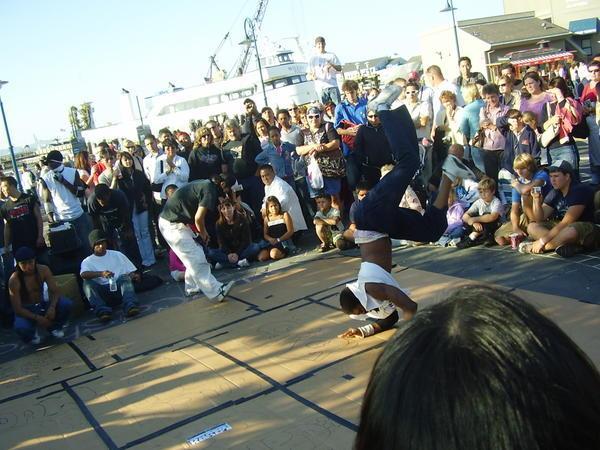 street performers near pier 39 having a break dancing competition