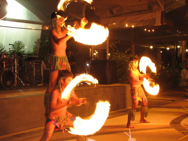 Boys dancing with fire at dinner