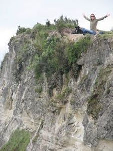 Sarah atop a steep cliff