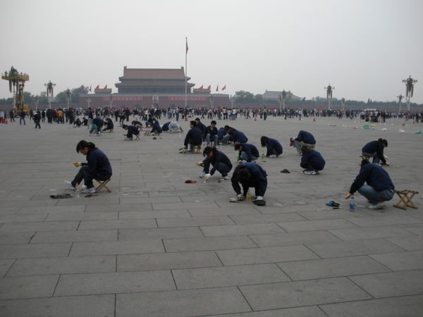 scraping spit from Tiananmen Square