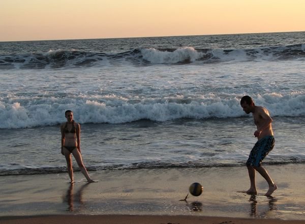 Playing soccer at the beach