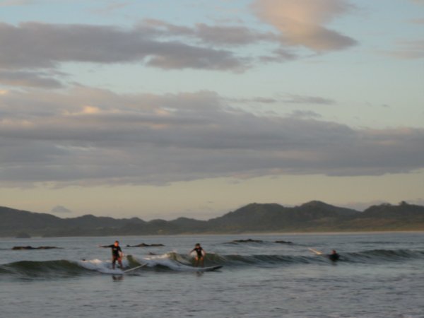 Surfers at the main beach at Tamarindo