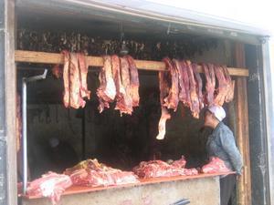 Local butcher with his stock of Yak meat