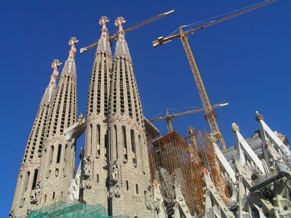 Gaudi with cranes and blue sky