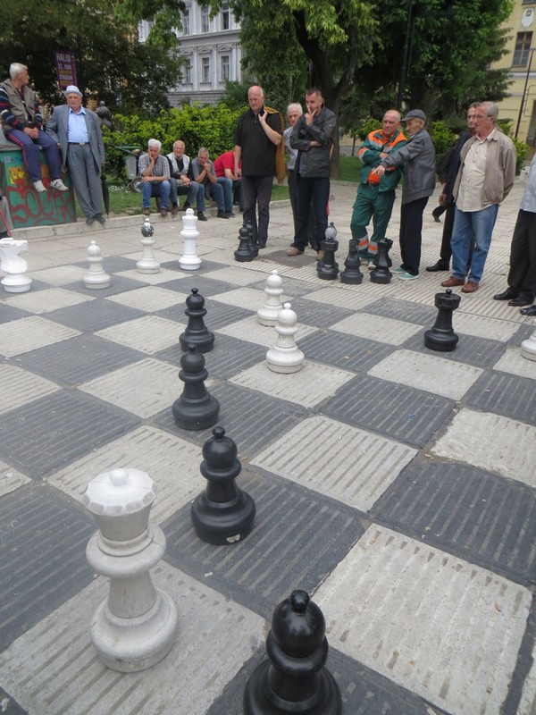 Local men playing chess 