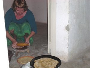 Making chapatis - its much easier in the kitchen at home!