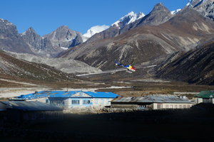 A helicopter landing at Pheriche