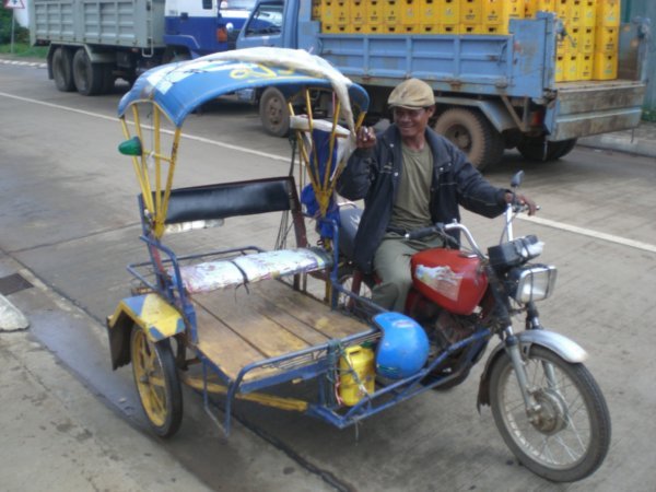 Pakse answer to black cabs! (The one that tipped over)