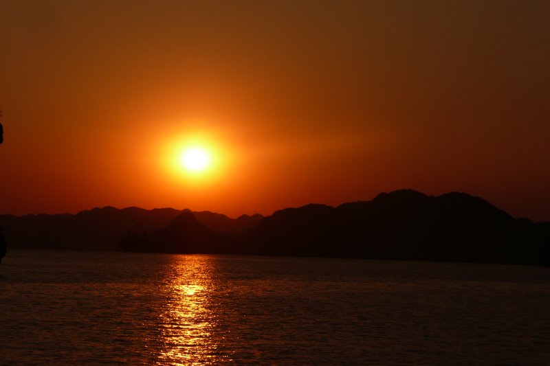 The sun sets over Halong Bay