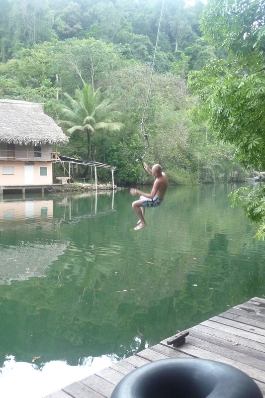 Mike does his Tarzan impression into the Rio Dulce