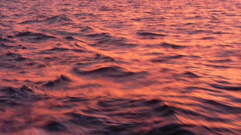 Sunset coloured waters during the open sea crossing to Cartagena