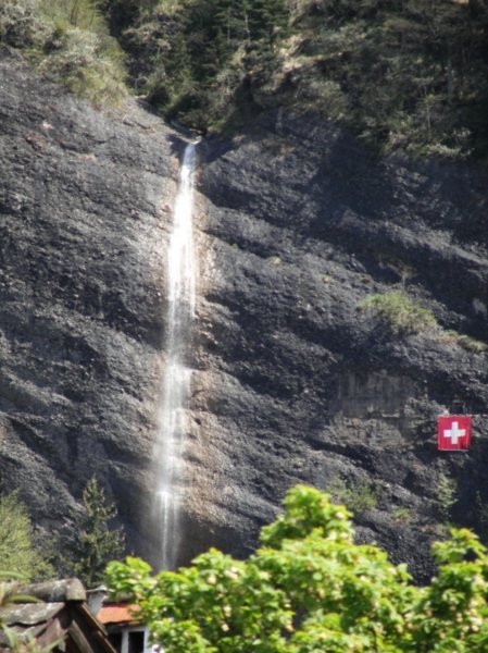 a waterfall with the Swiss flag....very Swiss , no!?!