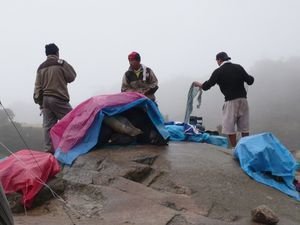 Our porters setting up for lunch in the rain