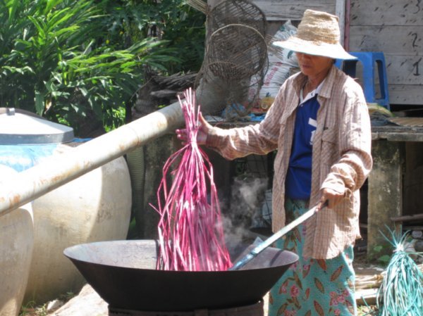 Straw being dyed for mat making