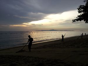 Sweeping Jomtiem Beach at Sunset