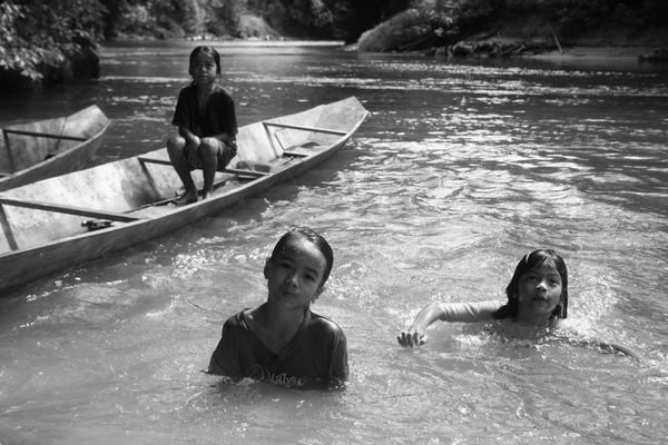 Iban children playing in the river