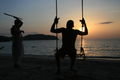 Sunset, swings and sticks