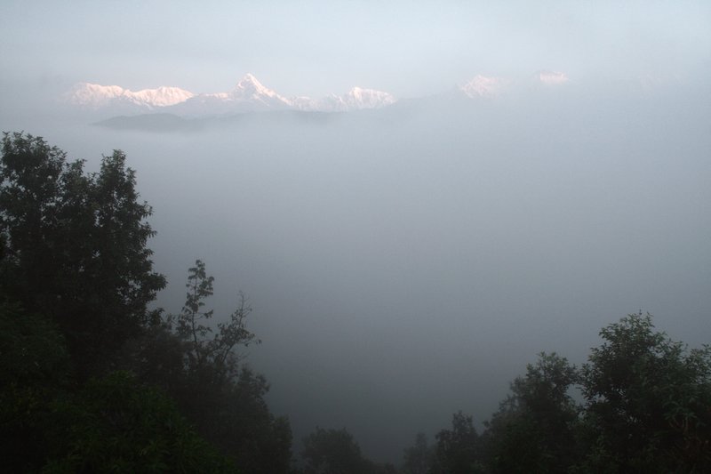 The Himalaya just visible through the early morning mist