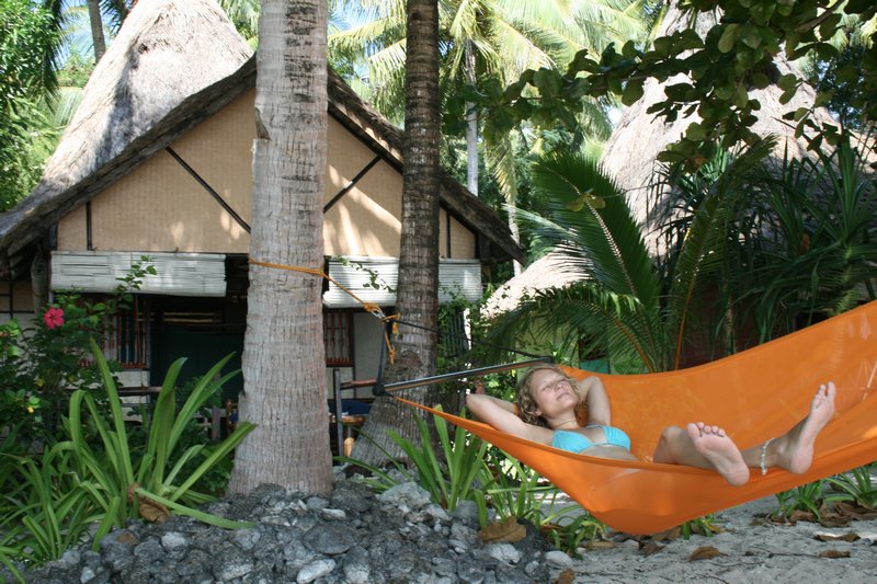 Anny on hammock and our bungalow