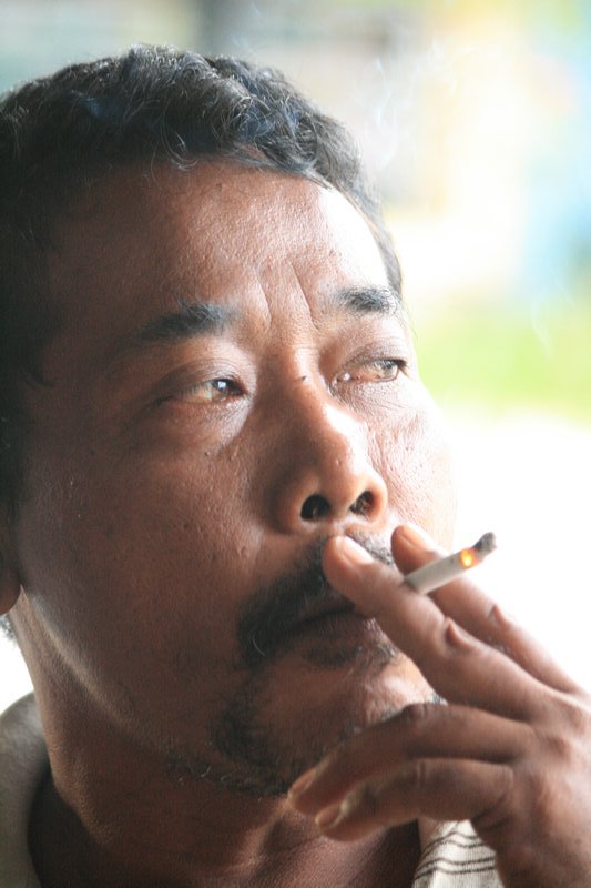 The verbose Mr. Jackie Chan in a rare moment of repose, with customary ciggy.
