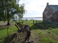 Old building and farm equipment, overlooking Norfolk Bay