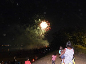Crowds enjoy the fireworks to celebrate the opening of the Mindil Beach Markets