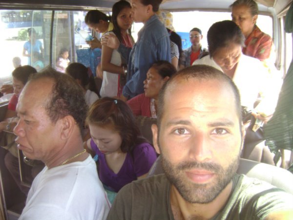 Riding the cramped Bus with the locals to Buddha Park