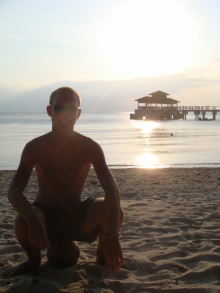 Dan at sunset, sitting ona coconut that fell earlier that day
