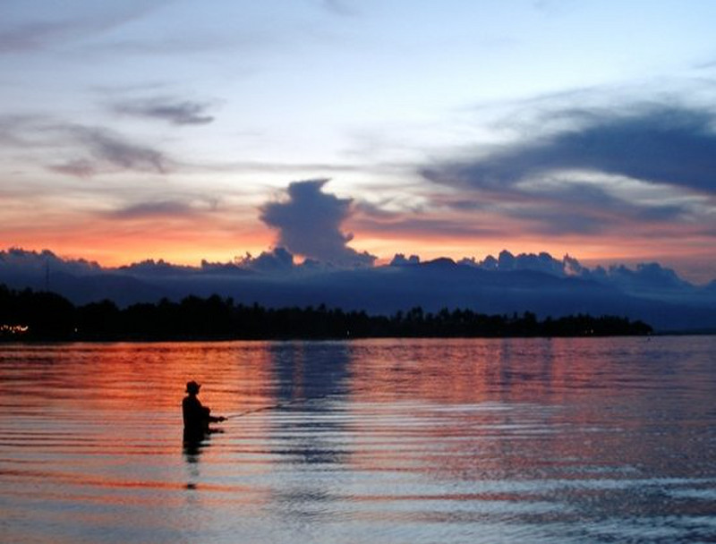 j - Fisherman at sunset