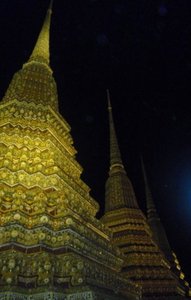 Wat Po, stupas outside at night