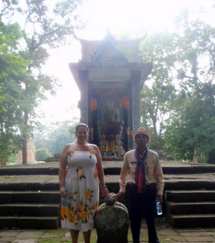 My guide and I at another Buddhist statue