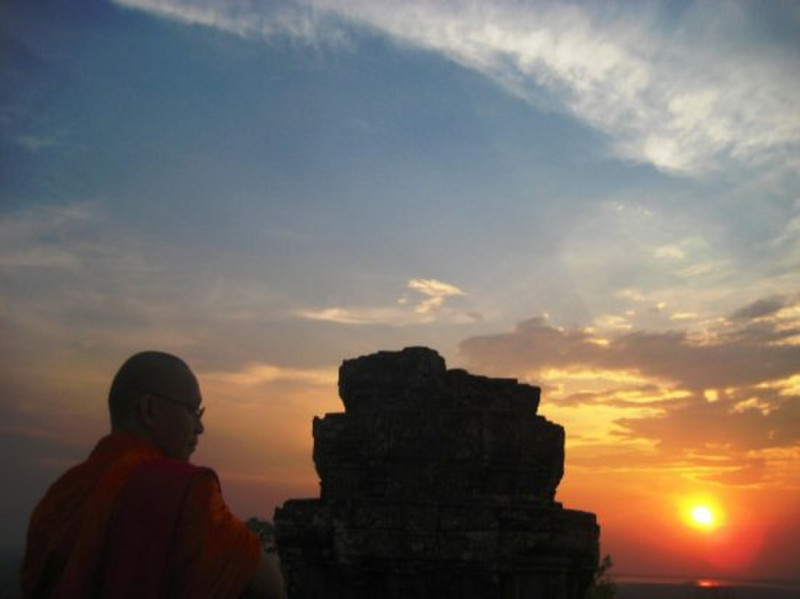 A monk at Phnom Bakheng at sunset