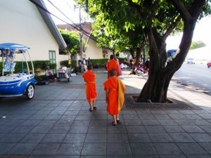 Monks on the sidewalk in Bangkok