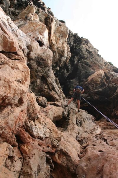 Abseiling down the cliff