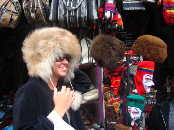 Christy tries out an alpaca hat