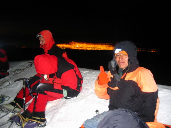 the lights of la Paz burn behind us while trying to stay warm and waiting for the sun at 5:30 a.m.