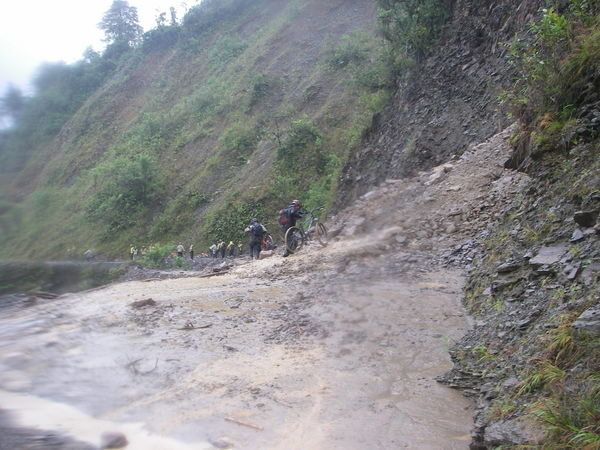 dismounting to cross a recent landslide