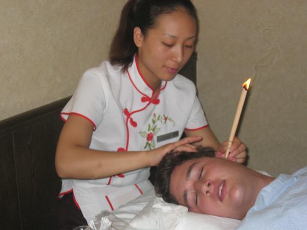The torch for the 2008 Bejing Olympic games starts in Jared's ear