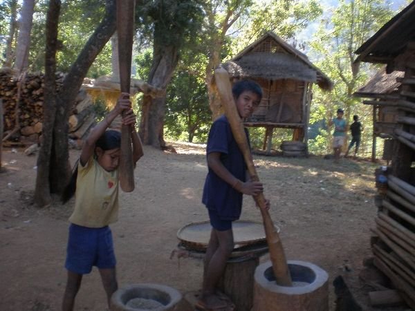 Kids Pounding Grain in the Minority Villages