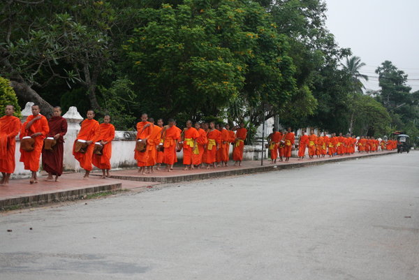 Monks accepting alms