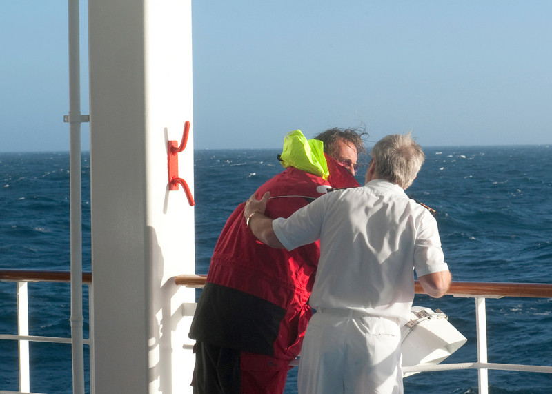 SHIP'S  DOCTOR TENDING TO THE RESCUED SAILOR