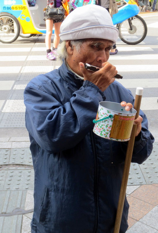 BLIND MAN PLAYING PIPE WHISTLE