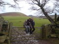 Lav and Steve take it easy on a farm gate