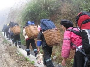 Mountain helpers on hike into Longji Mountains, China