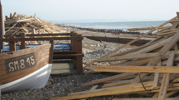 Boat stranded on Worthing's wooded beach, Sussex